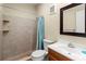 Well-lit bathroom features modern fixtures, a tiled shower, and ample vanity space at 3909 40Th W St, Bradenton, FL 34205