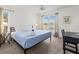 Sunlit bedroom with a ceiling fan and scenic views from the window creates a peaceful retreat at 3909 40Th W St, Bradenton, FL 34205
