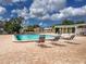 Community pool with lounge chairs and lush landscaping at 3909 40Th W St, Bradenton, FL 34205