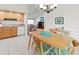 Open concept dining room with warm tones that open up into the living room and kitchen at 3909 40Th W St, Bradenton, FL 34205