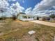 Street view of a single story home featuring a well-maintained lawn and mature landscaping at 3909 40Th W St, Bradenton, FL 34205