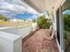 Inviting front patio with brick flooring, comfortable seating, and a charming outdoor ambiance at 3909 40Th W St, Bradenton, FL 34205