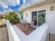 Inviting front patio with brick flooring and comfortable seating at 3909 40Th W St, Bradenton, FL 34205