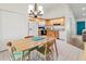 Bright kitchen features wood cabinets, modern appliances, and a breakfast nook under an elegant chandelier at 3909 40Th W St, Bradenton, FL 34205