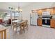Charming kitchen with adjacent dining area, tile flooring, and modern appliances at 3909 40Th W St, Bradenton, FL 34205