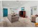 Inviting living room with ample seating, neutral decor, and lots of natural light from the large windows at 3909 40Th W St, Bradenton, FL 34205
