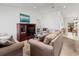 Bright living room with plush sofas, vaulted ceiling, and entertainment center at 3909 40Th W St, Bradenton, FL 34205