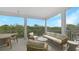 Inviting balcony with comfortable outdoor seating and stunning views of lush greenery at 4206 Saltwater Pearl Way, Cortez, FL 34215