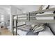Close up of a comfortable bunk bed in a bedroom with light colored walls and floors at 4206 Saltwater Pearl Way, Cortez, FL 34215