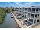 Aerial view displaying waterfront properties with private docks and community pools at 4206 Saltwater Pearl Way, Cortez, FL 34215