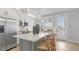 Modern kitchen featuring a center island, pendant lighting and stainless-steel appliances at 4206 Saltwater Pearl Way, Cortez, FL 34215