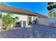 Paved backyard featuring fence, exterior view of building, and AC unit at 428 40Th W Ct, Palmetto, FL 34221