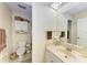 Clean bathroom featuring a vanity with a sink, toilet, and cabinet for storage at 428 40Th W Ct, Palmetto, FL 34221