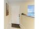 Bright entry foyer with tile floors, white door, and natural light from window at 428 40Th W Ct, Palmetto, FL 34221