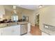 Open-concept kitchen with granite countertops, stainless steel appliances and an eat-in island bar at 428 40Th W Ct, Palmetto, FL 34221