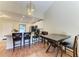 Bright kitchen featuring a breakfast bar, granite countertops, stainless steel appliances, and an elegant chandelier at 428 40Th W Ct, Palmetto, FL 34221