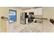 Modern kitchen featuring stainless steel appliances, granite counters, and white cabinets at 428 40Th W Ct, Palmetto, FL 34221