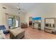 Bright living area boasts lots of natural light, vaulted ceilings, and wood floors at 428 40Th W Ct, Palmetto, FL 34221