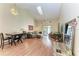 Spacious living room with vaulted ceiling, wood floors, comfortable seating, and sliding glass doors at 428 40Th W Ct, Palmetto, FL 34221