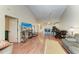 Open-concept living area showcasing vaulted ceilings, wood floors, and access to kitchen at 428 40Th W Ct, Palmetto, FL 34221