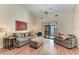 Cozy living room showcasing vaulted ceilings, a ceiling fan, and comfortable couches at 428 40Th W Ct, Palmetto, FL 34221