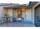 Inviting outdoor patio includes a table, chairs, and a view of the front door at 428 40Th W Ct, Palmetto, FL 34221