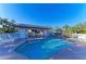 Community pool area with lounge chairs, covered seating, and clear blue water at 428 40Th W Ct, Palmetto, FL 34221