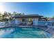 Inviting community pool area with sun loungers and covered seating for residents at 428 40Th W Ct, Palmetto, FL 34221