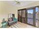 Inviting sunroom with serene decor, tile flooring, and bright, airy atmosphere at 428 40Th W Ct, Palmetto, FL 34221