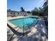 Community pool with clear water and sunny views at 4444 Swift Rd # 34, Sarasota, FL 34231