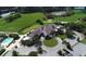 Aerial of clubhouse, parking, golf course and circular drive at 4640 Tower Hill Ln # 2325, Sarasota, FL 34238