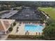 Overhead view of the pool, hot tub, tennis courts and the clubhouse in the Stoneybrook community at 4640 Tower Hill Ln # 2325, Sarasota, FL 34238
