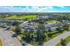 Aerial view of the golf course, clubhouse, tennis courts, pool and parking in Stoneybrook at 4640 Tower Hill Ln # 2325, Sarasota, FL 34238