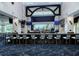 Modern bar area featuring a wide selection of beverages, comfortable seating, and multiple TV screens at 4640 Tower Hill Ln # 2325, Sarasota, FL 34238