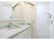 Bright bathroom offers shower, vanity, mirror and decorative fish art at 4640 Tower Hill Ln # 2325, Sarasota, FL 34238