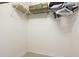 Empty walk-in closet with basic metal shelving at 4640 Tower Hill Ln # 2325, Sarasota, FL 34238