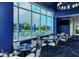 Bright dining area with golf course views, tables with linen service, and comfortable seating at 4640 Tower Hill Ln # 2325, Sarasota, FL 34238