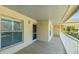 Exterior hallway featuring tile flooring, multiple windows, and a calming atmosphere at 4640 Tower Hill Ln # 2325, Sarasota, FL 34238