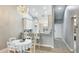 Charming kitchen with white cabinetry, cozy breakfast table, and a pendant chandelier at 4640 Tower Hill Ln # 2325, Sarasota, FL 34238