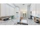 Modern kitchen with granite countertops, updated appliances, and seamless integration to the dining area at 4640 Tower Hill Ln # 2325, Sarasota, FL 34238