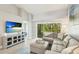 Cozy living space that blends relaxation with entertainment options including balcony and television at 4640 Tower Hill Ln # 2325, Sarasota, FL 34238