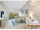 Beautiful living room with a comfy seating area that opens to the balcony and bright natural light at 4640 Tower Hill Ln # 2325, Sarasota, FL 34238