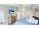 Spacious main bedroom offers closet, TV, and ensuite bathroom at 4640 Tower Hill Ln # 2325, Sarasota, FL 34238