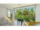 Enjoy the scenic views of lush tropical foliage from this screened-in porch with Adirondack chairs at 4640 Tower Hill Ln # 2325, Sarasota, FL 34238