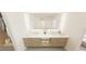 Elegant bathroom features a double vanity, marble countertop, and soft lighting to create a luxurious spa-like experience at 4950 Remington Dr # 104, Sarasota, FL 34234