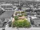Aerial view of the property with mature landscaping and a pond at 5024 37Th E St, Bradenton, FL 34203