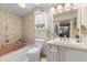 Well-lit bathroom featuring a bathtub, vanity with plenty of storage, and decorative fixtures at 5024 37Th E St, Bradenton, FL 34203