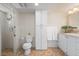 Functional bathroom featuring a walk-in shower with grab bar, ample storage, and a neutral color palette at 5024 37Th E St, Bradenton, FL 34203