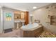 Luxurious bathroom with a soaking tub, dual sinks, and a separate shower at 5024 37Th E St, Bradenton, FL 34203