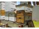 Close-up of organized beehives, showcasing the opportunity for honey production on the property at 5024 37Th E St, Bradenton, FL 34203